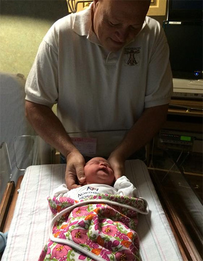 Adjusting babies at Braile Chiropractic in Marietta GA